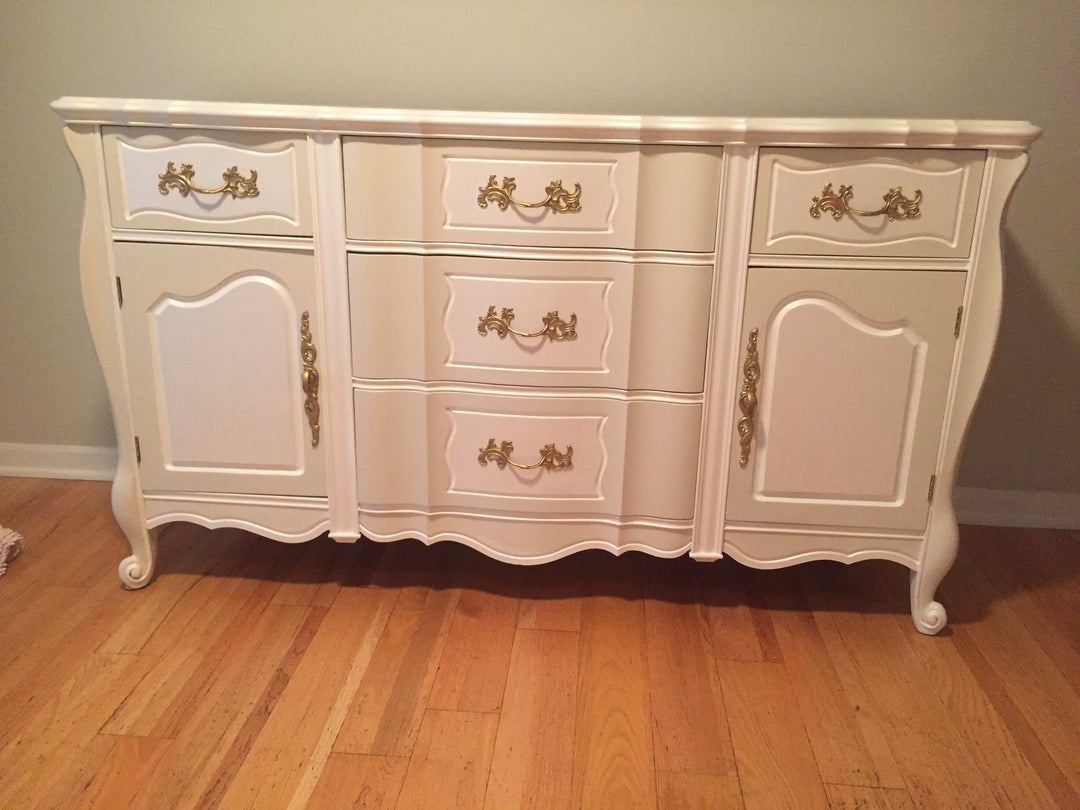 antique refinished wood armoire painted white with gold finishings 