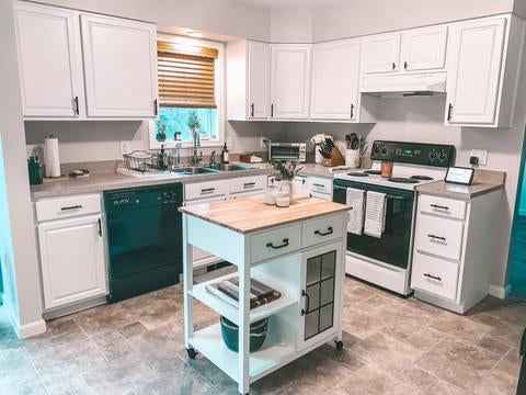 kitchen with white cabinets and an island in the center