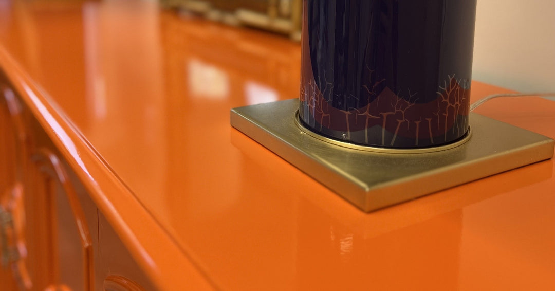 close up of a refinished wood cabinet in a bright orange color