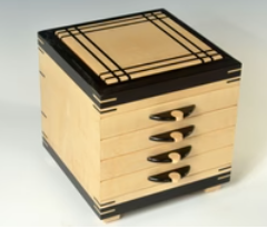 maple and ebony jewelry box with four drawers